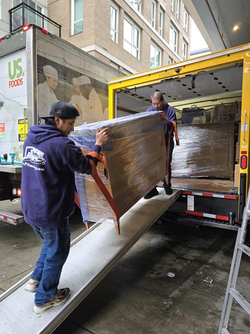 Local movers loading a moving truck in Kent