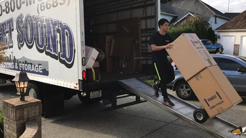 Movers unloading a moving truck in Kent