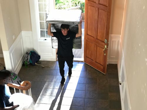 Residential movers carrying furniture in Kent